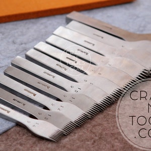 May include: A set of 10 silver leather stitching tools with a serrated edge. The tools are arranged in a row, with the smallest tool on the left and the largest tool on the right. The tools are labeled with numbers from 1 to 10. The tools are on a gray surface. The text "CRAFT N TOOLS .COM" is visible in the lower right corner of the image.