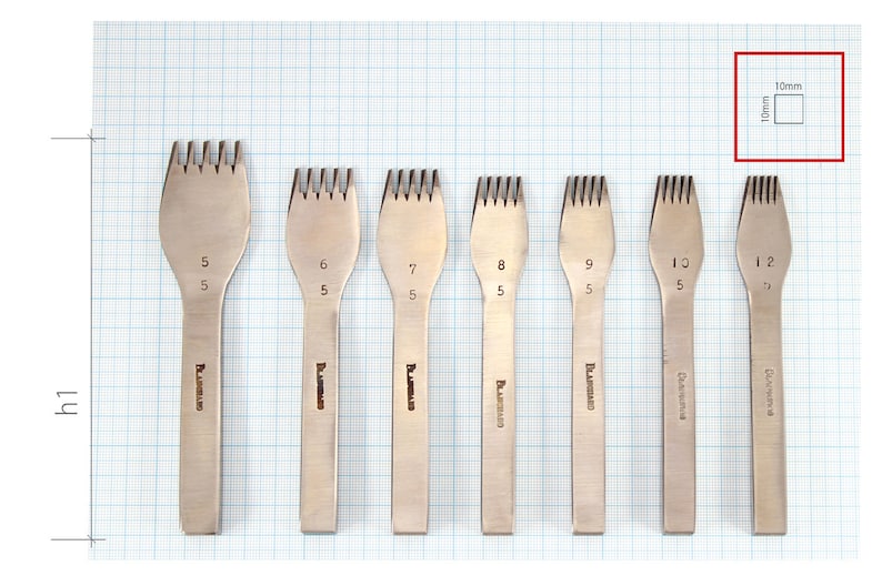 May include: Set of eight leather stitching tools with different sized prongs. The tools are made of metal and have a silver finish. The tools are labeled with numbers 5, 6, 7, 8, 9, 10, and 12. The tools are arranged in a row on a grid background.