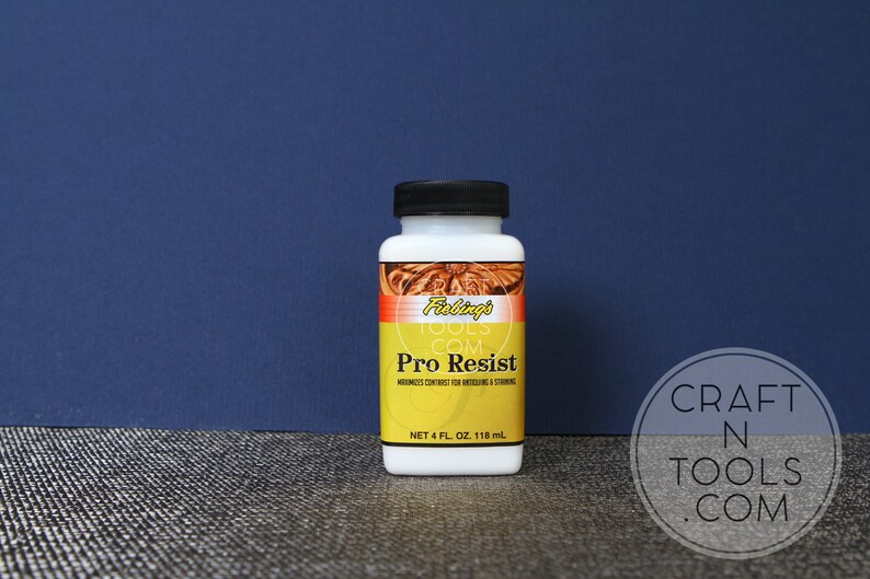 May include: A white bottle of Felings Tools Pro Resist leather working solution. The bottle is labelled with the text "Felings Tools.com Pro Resist" and "NET 4 FL. OZ. 118 ml".