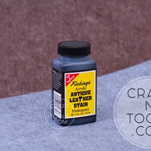 May include: A bottle of Fiebing's Antique Leather Stain in Mahogany color. The bottle is 4 fluid ounces (118 ml).