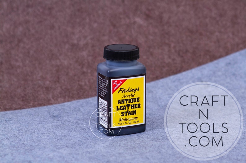 May include: A bottle of Fiebing's Antique Leather Stain in Mahogany color. The bottle is 4 fluid ounces (118 ml).