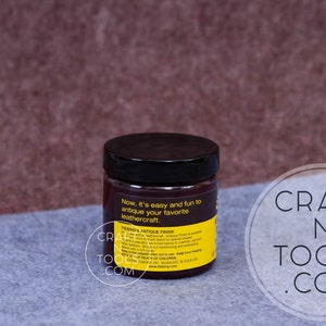 May include: A small jar of leather antique finish. The jar is yellow with black lettering and a black lid. The text on the jar reads "Now it's easy and fun to antique your favorite leathercraft.  FRENGSANTIQUE FINISH".
