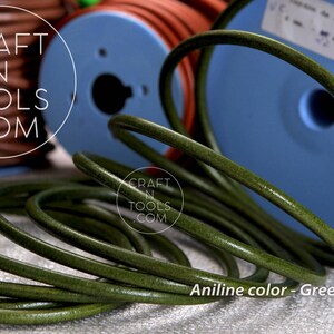 May include: Close-up of a spool of green leather cord. The cord is coiled and has a smooth, polished finish. The text "Aniline color - Green Hunter" is visible at the bottom of the image.