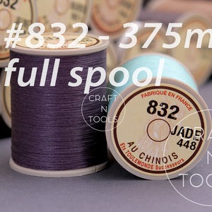 May include: A full spool of purple thread labeled #832-375m, with the text "Craft N Tools" and "Au Chinois" on the label.