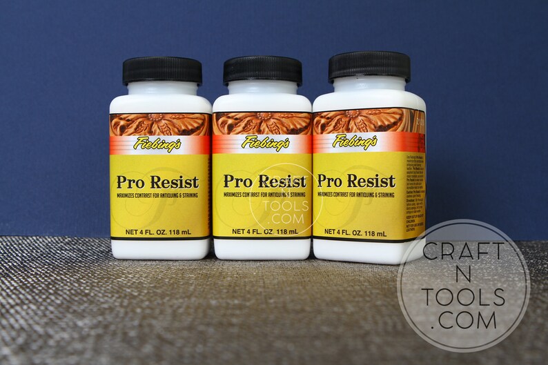 May include: Three bottles of Fiebing's Pro Resist leather conditioner. Each bottle is white with a yellow label and contains 118 ml.