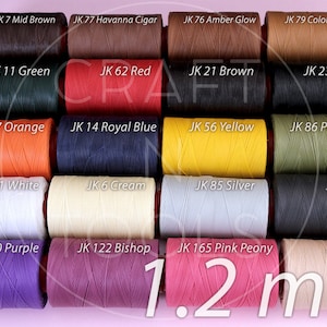May include: A collection of 20 spools of 1.2 mm thread in various colors, including red, blue, green, orange, yellow, brown, black, white, purple, and beige. Each spool is labeled with a JK number and a color name.