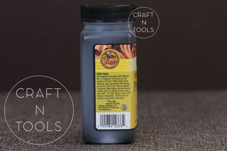 May include: A small black bottle of Fiebing's Leather Dye. The bottle has a yellow label with the Fiebing's logo and directions for use. The label also includes the text "Made in the U.S.A."