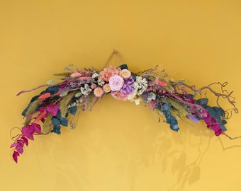 Dried Flower Spring Summer Display. Mantlepiece or hanging arrangement made with twisted branches, dried flowers and preserved foliage.