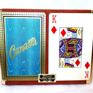 May include: A set of three ceramic mugs with a speckled, matte finish. The mugs are in shades of cream, light gray, and dark gray. Each mug has a simple, minimalist design and a rounded handle.