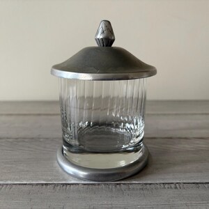 vintage glass tobacco jars Jar with an antiqued silver lid for added appeal Antique Clear Glass Tobacco Jar