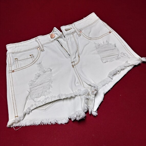 white destroyed shorts