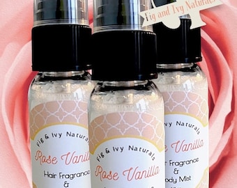 May include: Three clear plastic spray bottles with black caps, each containing 1 fl oz of Rose Vanilla hair fragrance and body mist. The labels feature a white lattice pattern on a peach background with the text Fig and Ivy Naturals.