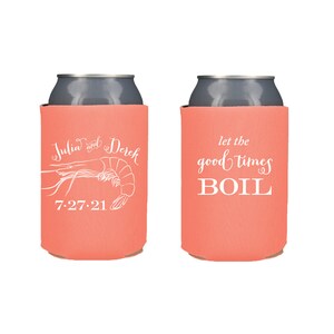 May include: Two coral-colored beverage insulators with white text. One insulator has a shrimp illustration and the text "Julia and Derek 7-27-21". The other insulator has the text "Let the good times boil."