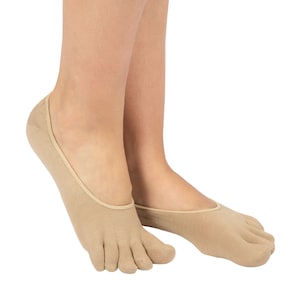 May include: A pair of nude-coloured toe socks with a seamless design. The socks are made of a soft, breathable fabric and are perfect for wearing with flats or sandals.