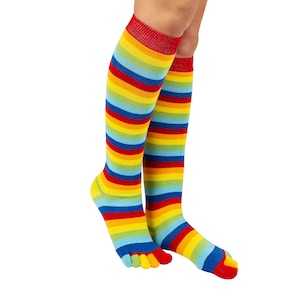 May include: A pair of colorful striped knee-high socks with toe separators. The socks are red, yellow, blue, and green.