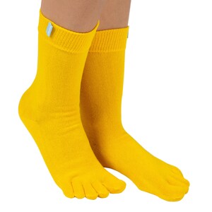 May include: A pair of yellow toe socks with a light blue tag on the ankle.