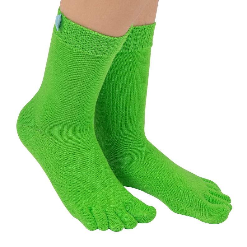 May include: A pair of bright green toe socks with a small blue tag on the ankle.