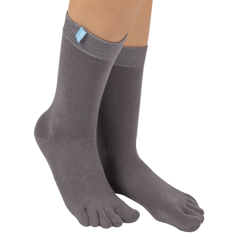 May include: A pair of gray toe socks with a small blue label on the ankle.