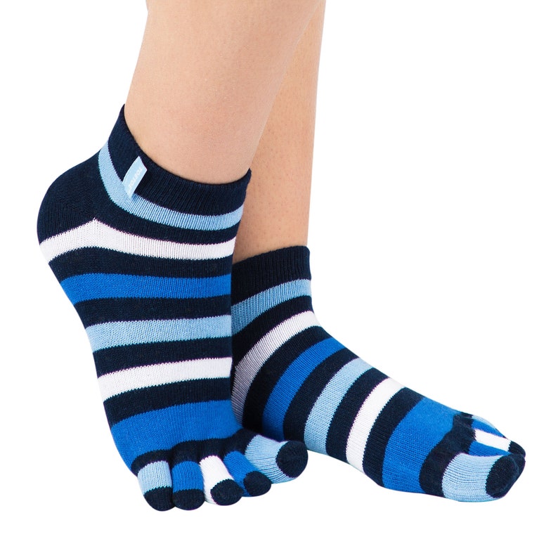 May include: A pair of blue and white striped toe socks. The socks feature a navy blue cuff with a small tag and a pattern of horizontal stripes in varying shades of blue and white. The toe section is separated for each toe.
