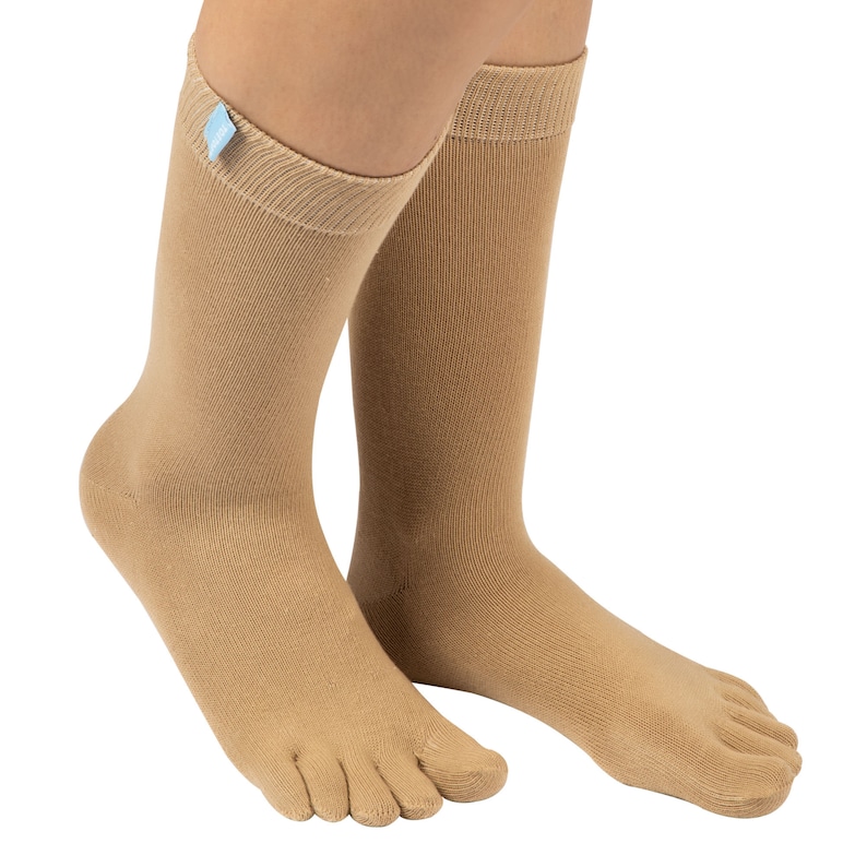 May include: A pair of beige toe socks with a light blue tag on one sock. The socks are made of a soft, breathable fabric and are designed to provide comfort and support.