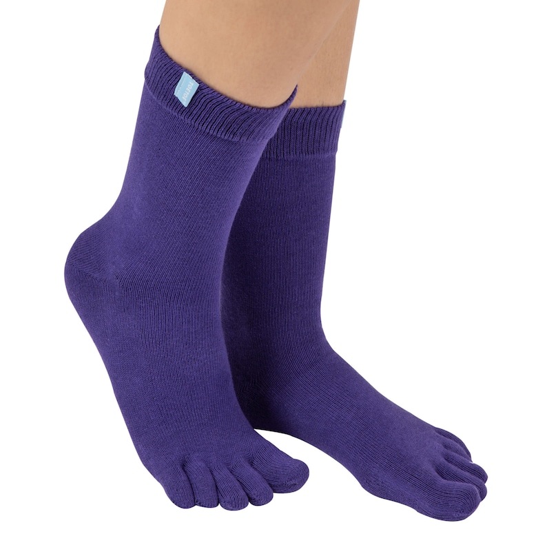 May include: A pair of purple toe socks with a small blue label on one sock.
