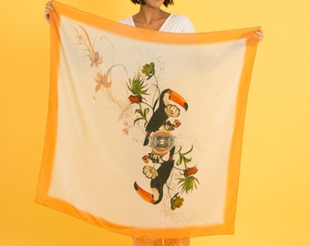 Orange 'Toucan' square Silk Scarf from the Evolution Collection with floral and bird illustration