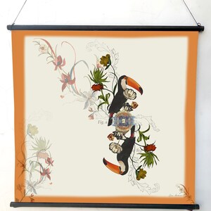 May include: A vintage illustration of two toucans perched on a branch with intricate floral designs. The toucans are black with orange beaks and white accents. The flowers are in shades of pink, red, and yellow. The illustration is on a cream background with a peach border.