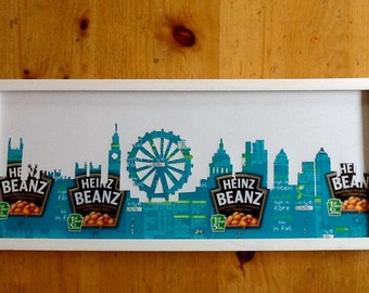 The London Skyline finely cut out of real Baked Bean labels on a white background, frame not included.
