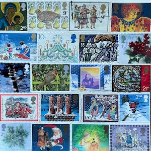 Set of 4, Commemorative Christmas Cards. Ivory card & envelope 6” square. REAL used British Christmas Stamps with post marks.