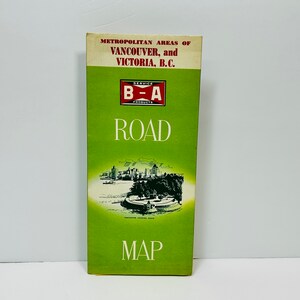 May include: A green and white vintage road map for the metropolitan areas of Vancouver and Victoria, British Columbia. The map is titled "B-A Road Map" and features a small illustration of the city skyline.