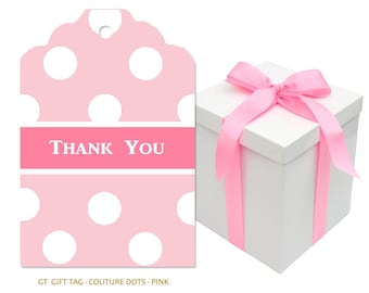 May include: A white gift box tied with a pink satin ribbon, next to a pink gift tag with white polka dots. The tag has the words "THANK YOU" in white letters on a pink banner.