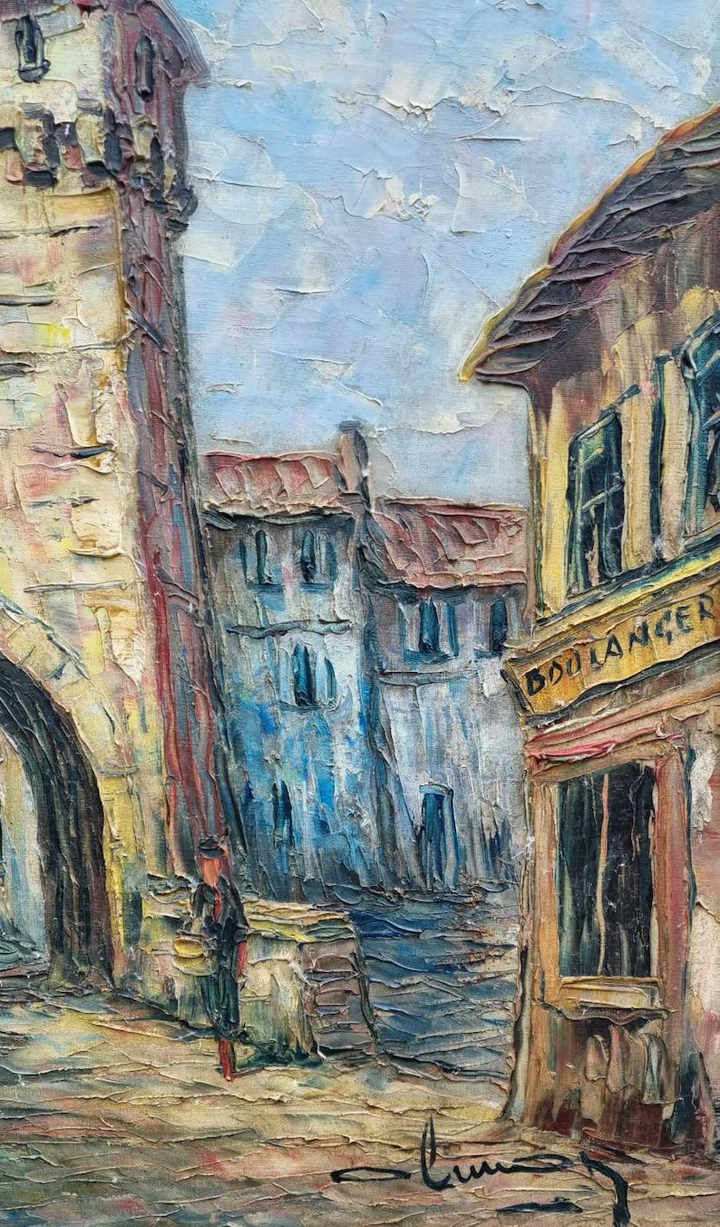 May include: A painting depicting a European street scene with a tall stone tower, a building with a sign that reads "BOULANGER", and a person walking in the street.