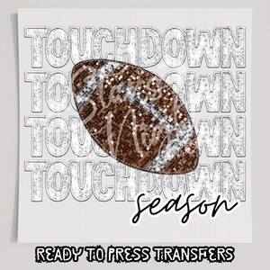 May include: A brown and silver glitter football with the text "Touchdown Season" in silver glitter letters.