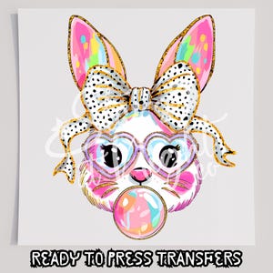 May include: A pink and white bunny with glitter and rainbow accents wearing a black and white polka dot bow and heart-shaped sunglasses. The bunny is blowing a bubblegum bubble.