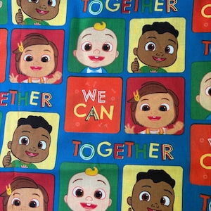 May include: A blue fabric featuring a repeating pattern of cartoon characters in square frames of red, yellow, and green. The text WE CAN TOGETHER is printed in yellow and green letters throughout the design, interspersed with the character faces.