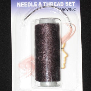 May include: A brown thread and needle set in a plastic packaging. The packaging has the text "Eden" and "Needle & Thread Set" printed on it. The item number is 10033.