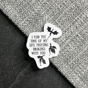 May include: White sticker with black text and three black dragon silhouettes. The text reads "I had the time of my life fighting dragons with you."