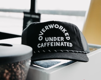 Overworked Under Caffeinated Hat