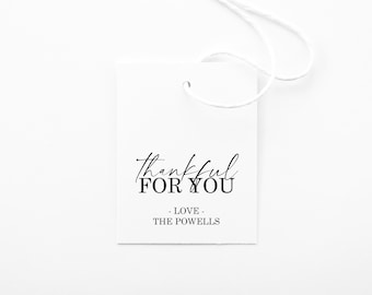 May include: White gift tag with black text that reads "thankful for you - love - the powells".