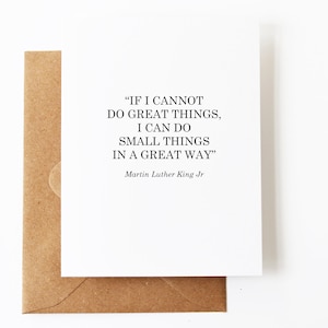 May include: A white card with a black quote by Martin Luther King Jr. that reads "IF I CANNOT DO GREAT THINGS, I CAN DO SMALL THINGS IN A GREAT WAY".