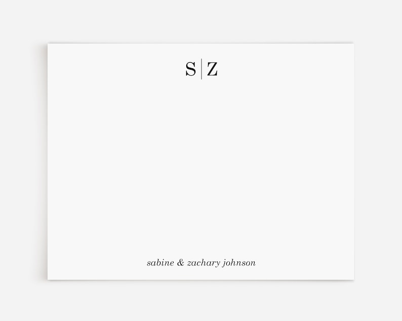 May include: A white card with the initials "S|Z" and the text "sabine & zachary johnson" printed in black.