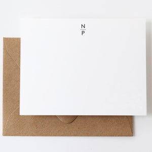 May include: A white card with a brown envelope. The card has the text "N_P" printed in black.