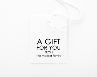 May include: A white gift tag with black text that reads "A Gift For You From the Moeller Family".