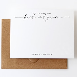 May include: A white card with the text "A note from the bride and groom" in black cursive script. The card also has the text "Ashley & Stephen" printed in black at the bottom.
