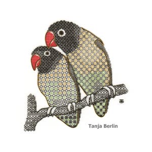 May include: Two embroidered lovebirds perched on a branch. The birds have black heads, red beaks, and bodies with a geometric pattern in shades of gold, green, and black. The branch is brown with white accents. The text "Tanja Berlin" is below the birds.