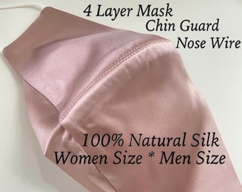 May include: A light pink silk face mask with a nose wire and chin guard. The mask is made of 100% natural silk and has four layers. The text "4 Layer Mask Chin Guard Nose Wire 100% Natural Silk Women Size * Men Size" is printed on the mask.