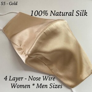 May include: A gold-colored, four-layer face mask made of 100% natural silk. The mask has a nose wire and is available in women's and men's sizes.  "S5 - Gold" and "100% Natural Silk" are printed on the mask.