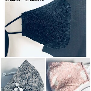 May include: Three face masks in black, grey, and pink lace. The black mask is displayed at an angle. The grey mask has a decorative jewel. The pink mask has a white lining. Text on the image reads "Lace- black", "Lace- Grey", and "Lace- Pink".