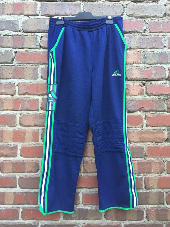 blue adidas pants with green stripes