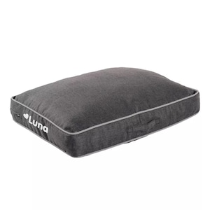 May include: A gray dog bed with a white "Luna" logo and a gray handle.